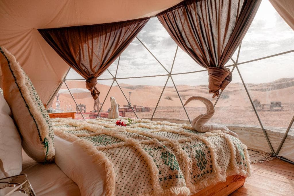 Comfortable tent accommodation overlooking Morocco's desert landscape